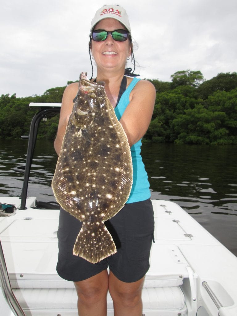 Lynn Manzella of Largo with a doormat flounder caught on a CAL Shad.