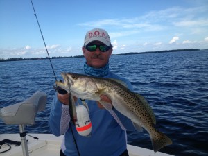 Capt. Ray Markham with a Sarasota Bay trout caught on a topwater MirrOlure Top Dog.